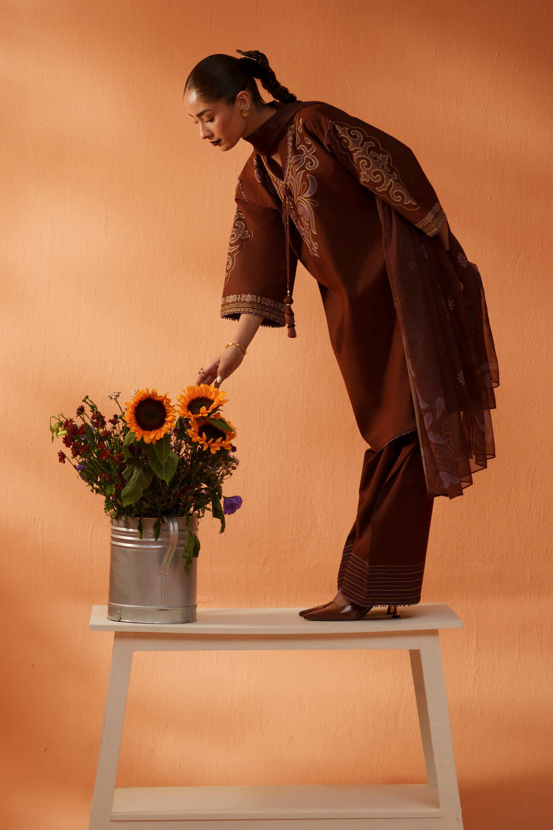 Fiona brown embroidered ready-to-wear outfit styled with floral setup, lawn shirt, cambric shalwar, and printed chiffon dupatta.
