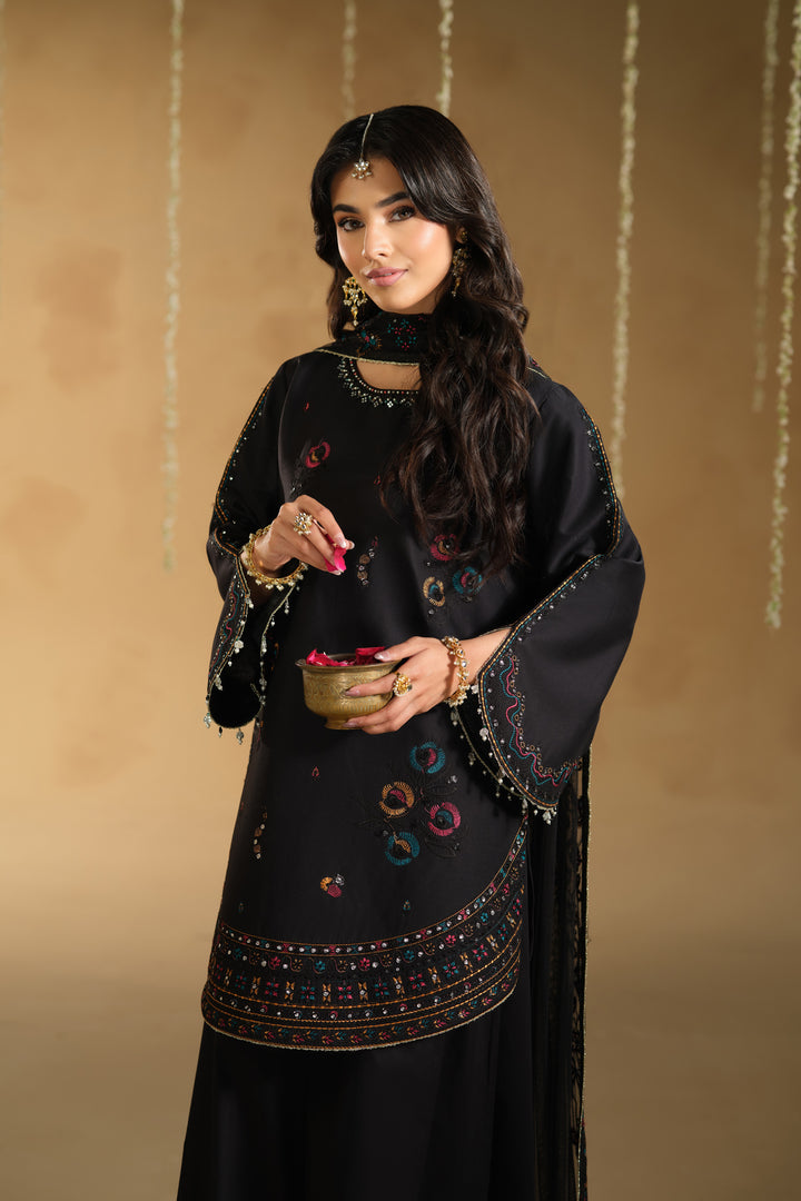 Close up of Lael sleeve and hem border embroidery detailing on black Pima lawn festive outfit