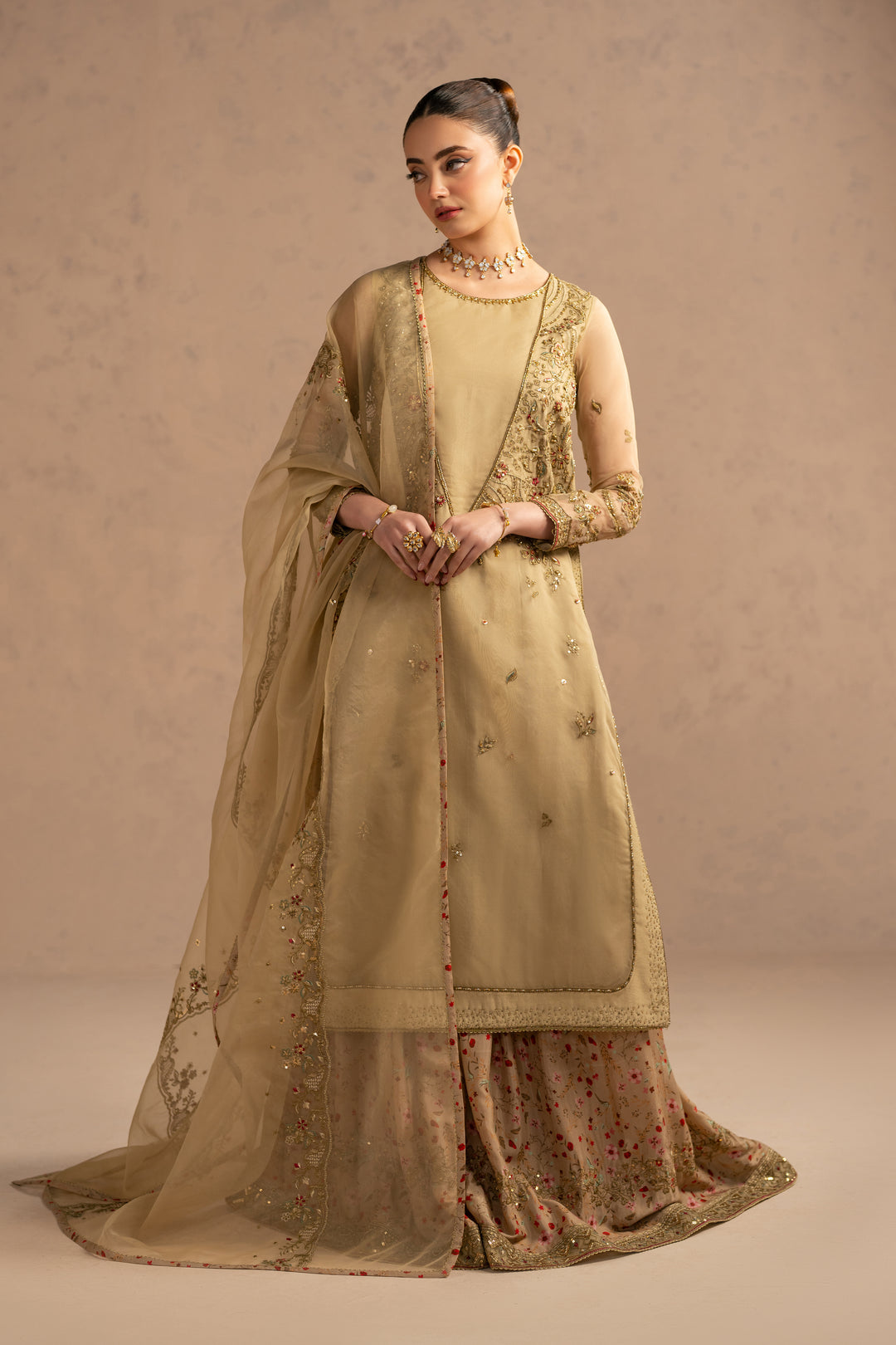 Full view showing balanced proportions of long shirt and wide sharara flare, suitable for nikkah and engagement gatherings.