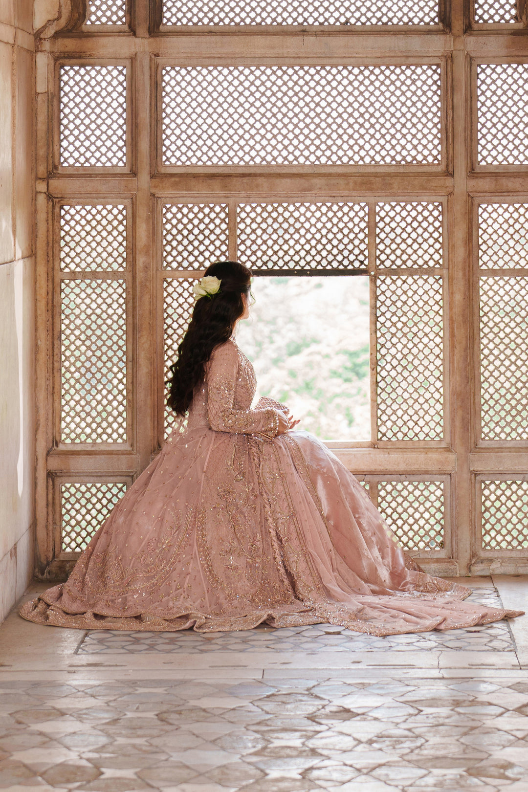 Wide floor shot of NAQSHI Mareeha soft pink formal dress showing full flare and intricate embroidery for weddings and party celebrations.