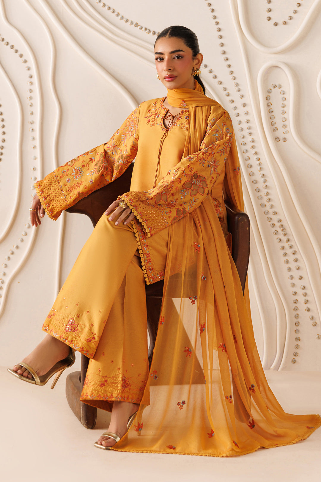 Front styling of NAQSHI Lunara outfit showing crinkle dupatta flow, rust tone, and refined casual look