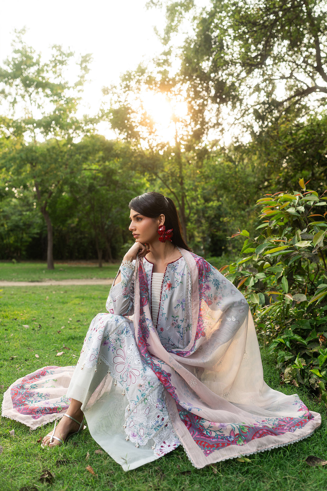 Sitting pose of Zimra grey summer outfit showing straight cambric trouser and relaxed comfortable styling