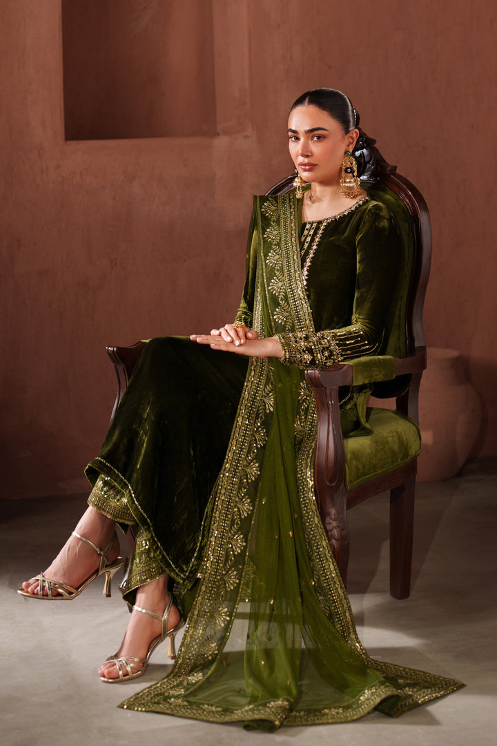 Side pose of NAQSHI dark green ready-to-wear formal outfit styled with matching dupatta for event wear