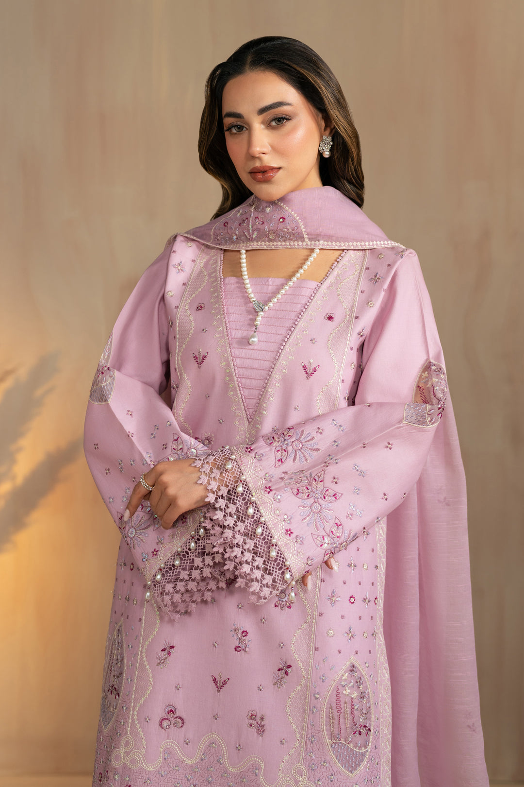 Front styling portrait highlighting embroidered neckline and balanced design of Shayleigh lilac lawn dress, elegant 3 piece Pakistani outfit.