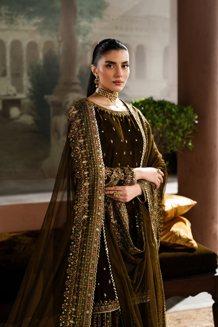 Slight angle shot of Danara 3-piece velvet sharara dress in mehndi green with embroidered shirt and flowing dupatta — NAQSHI premium design