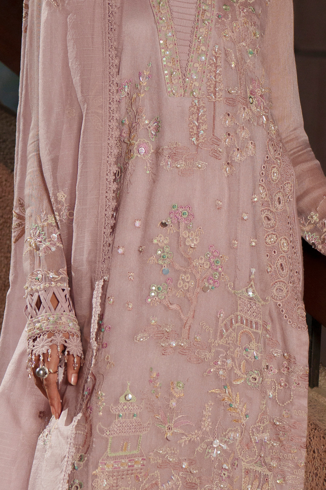 Close-up of Anahi lilac embroidered khadi net shirt highlighting sequin embroidery, pintuck details, organza floral border and refined craftsmanship
