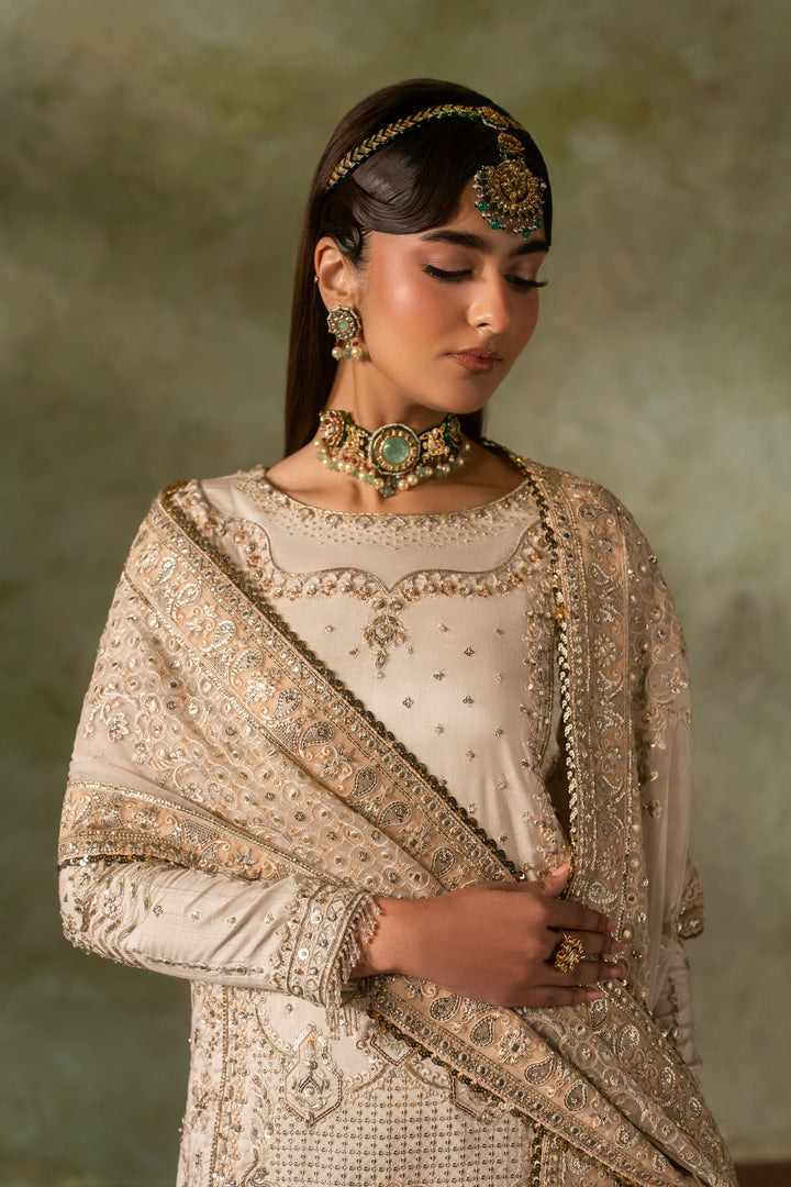 Upper body portrait of Damiya Nikkah dress showing neckline embroidery and dupatta styling in off white tone, elegant bridal formal wear.