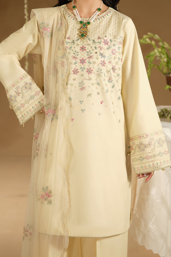 Close up of Arosel shirt jaal embroidery and neckline detailing on beige Pima lawn fabric