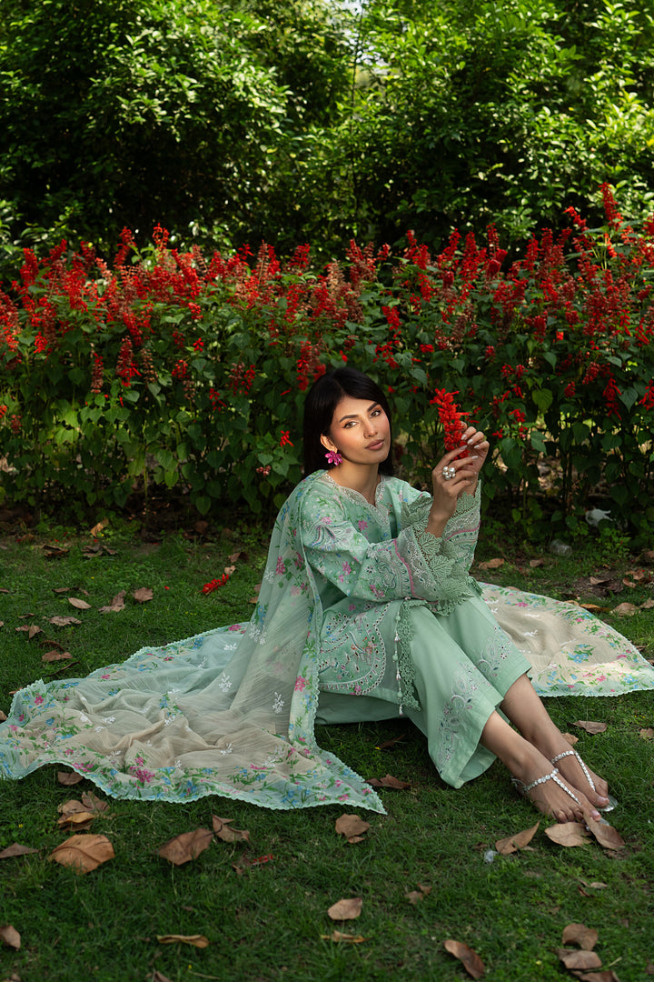 Sitting pose of Menesa aqua green summer outfit showing wide culotte trouser and breathable lawn fabric for comfort