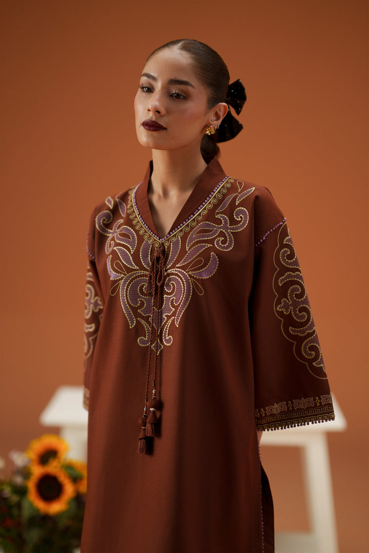 Close-up of Fiona brown embroidered lawn shirt with collar neckline, tassel detail, loose sleeves, and soft festive styling.