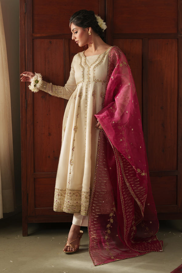 NAQSHI Rumi front view: off‑white viscose Masoori frock with adda embroidery at neckline, subtle front slit, fitted sleeves, paired with raw‑silk trousers