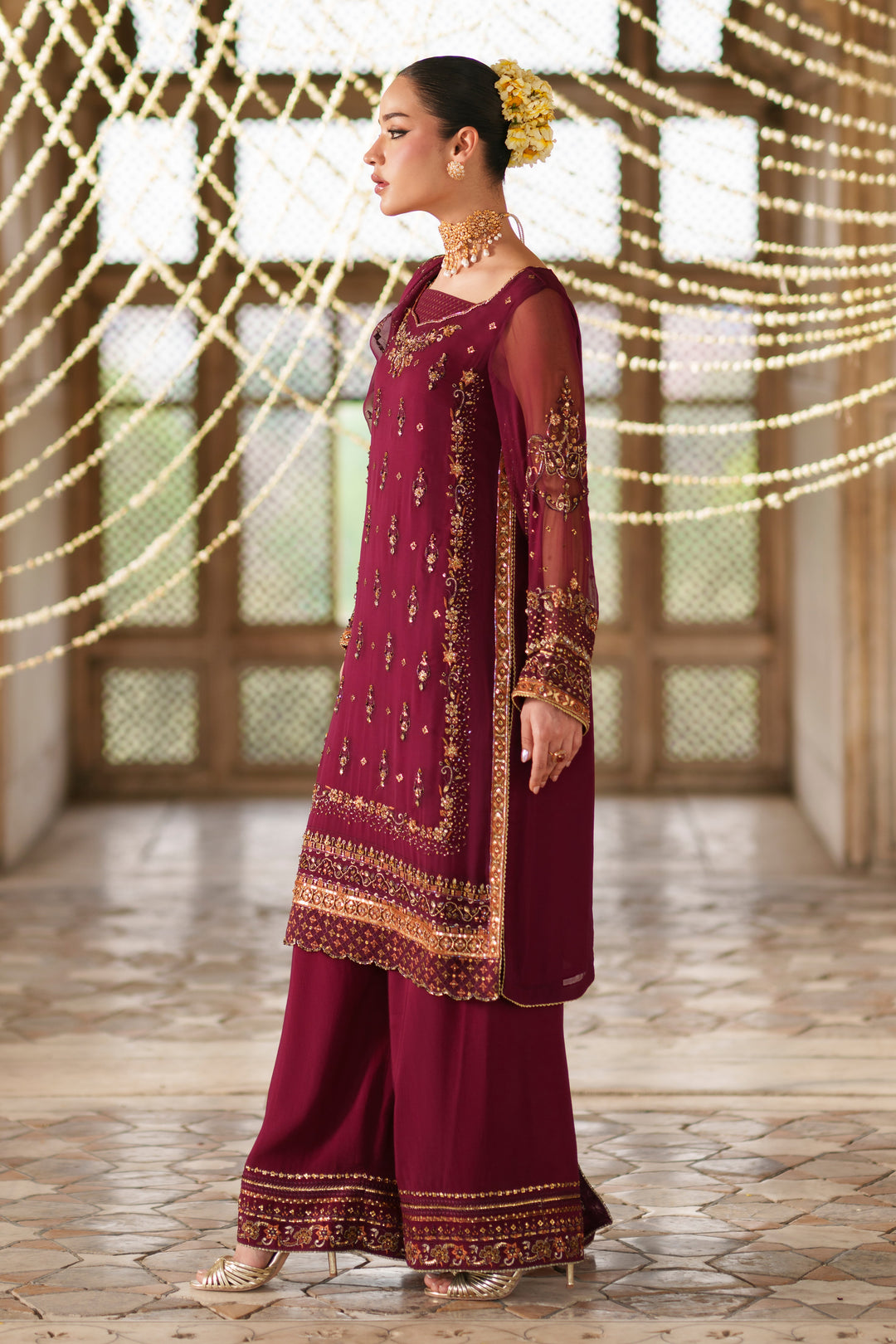 Side view of Ehaad plum crinkle semi formal outfit featuring embellished borders, flowing dupatta and festive Eastern wear styling