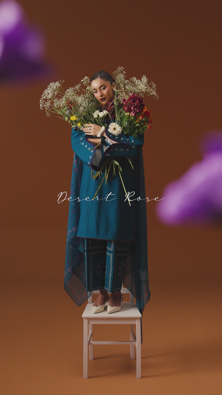 Juni teal ready-to-wear outfit video preview featuring embroidered lawn shirt, printed chiffon dupatta, and modern Eastern styling.