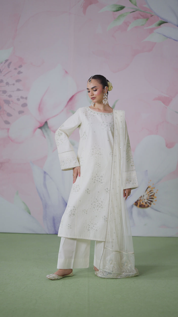 Full length view of Preeti off white 3 piece outfit showing balanced straight shirt cut with culotte trousers