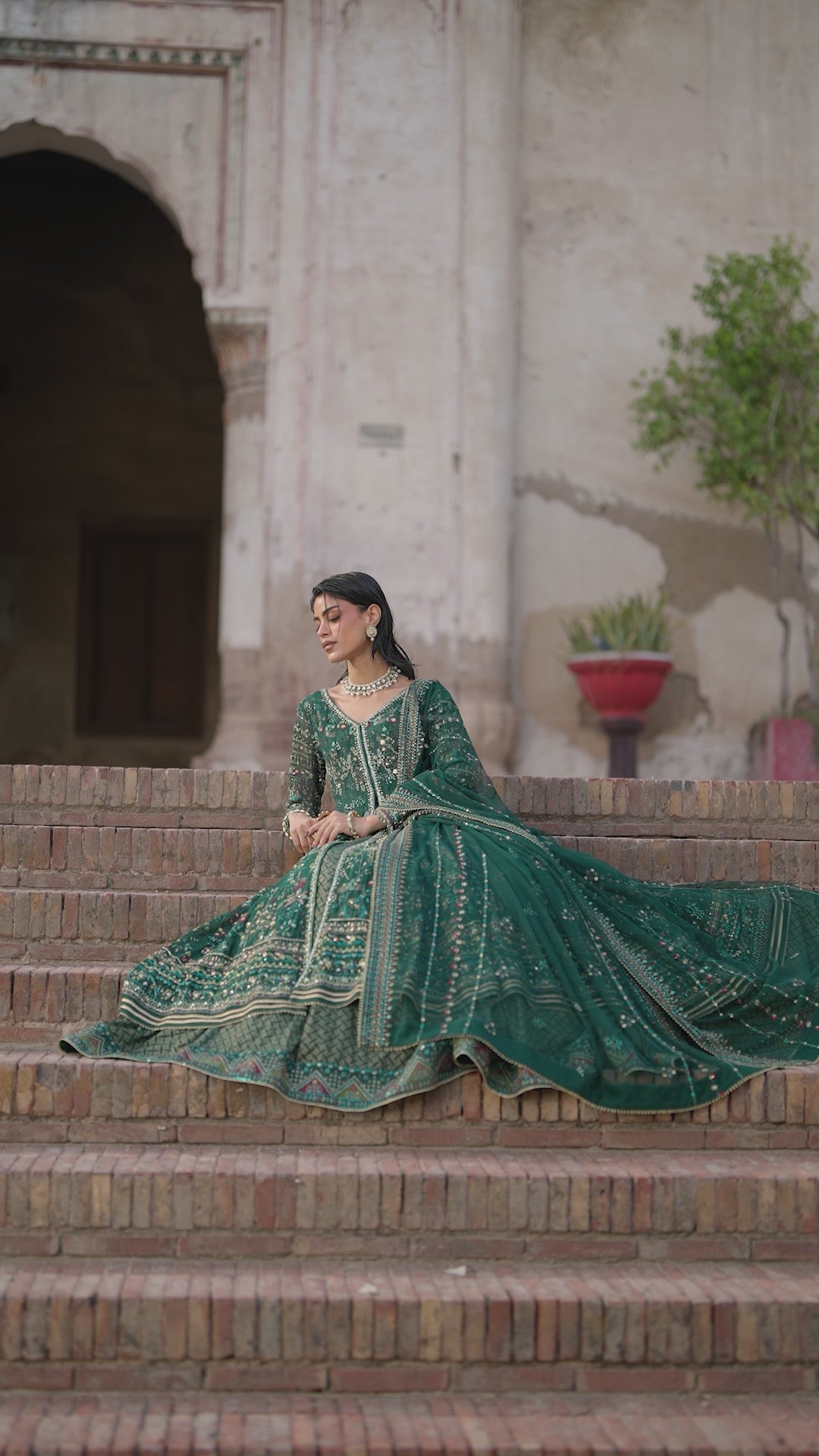 Etta deep green Crinkle evening maxi video showing V-neck adda work, embroidered panels and flowing flare.