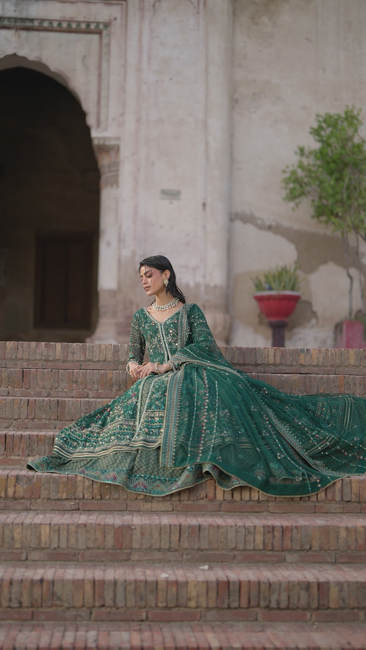 Etta deep green Crinkle evening maxi video showing V-neck adda work, embroidered panels and flowing flare.