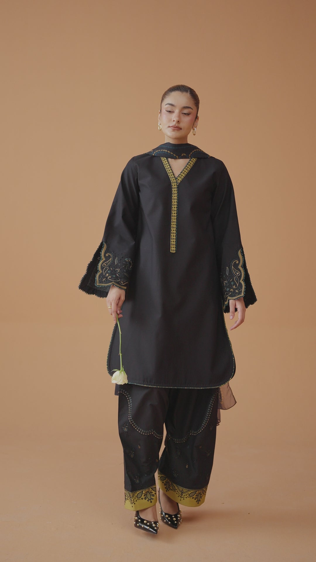 Vera black ready-to-wear outfit video preview featuring embroidered lawn shirt, cambric shalwar, printed chiffon dupatta, and modern Eastern styling.