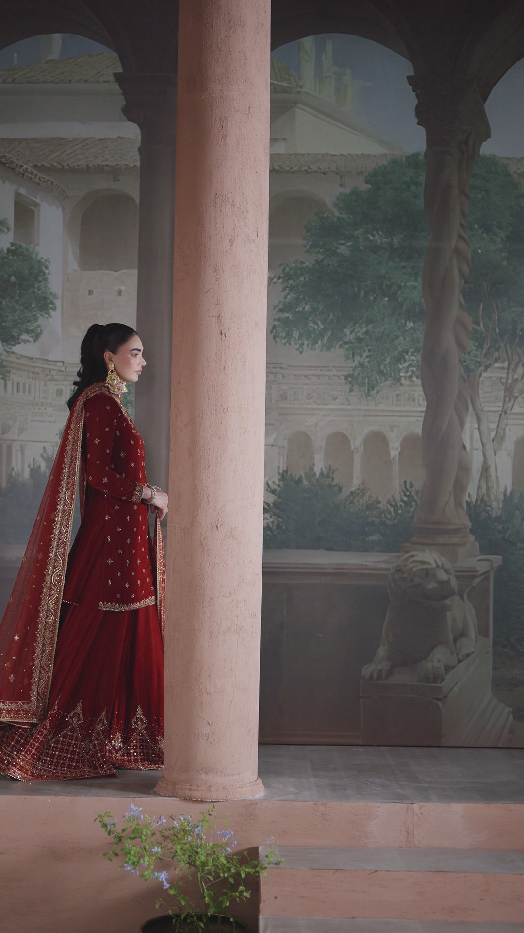 Tall vertical shot of NAQSHI Vaneeza rust velvet embroidered sharara set with net dupatta, showing full outfit fall and design — ideal ready-to-wear look