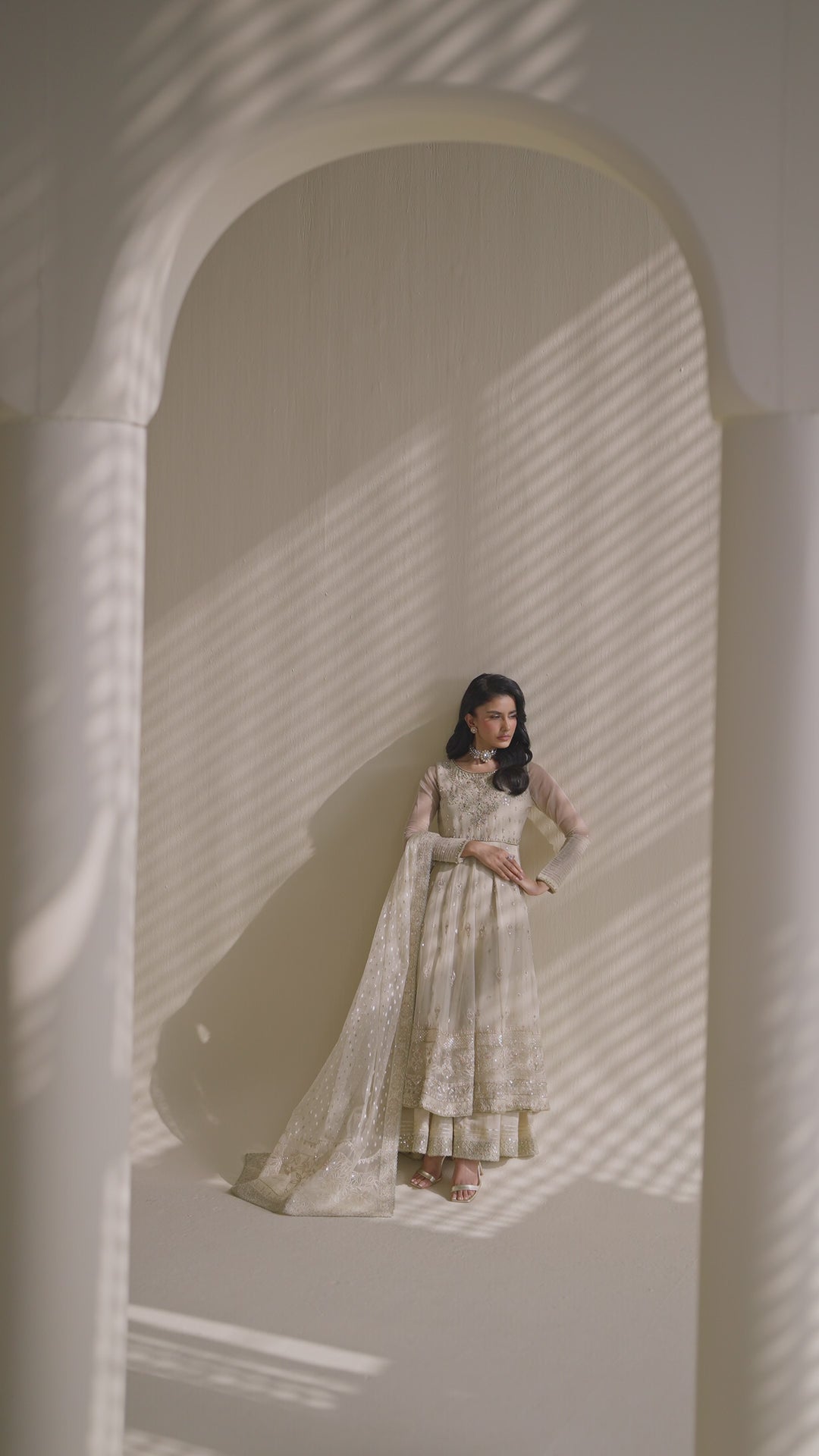 Tall shot of NAQSHI Aroha off-white organza and raw-silk dress with flowing silhouette — semi-formal ready-to-wear outfit for parties and events