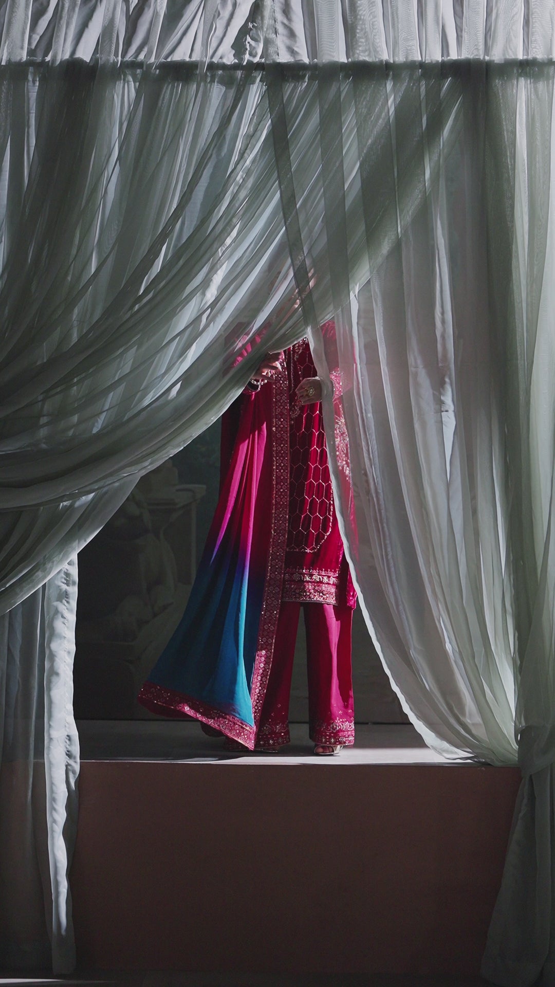 Video preview of NAQSHI deep red formal ready-to-wear 3-piece outfit showing complete event-ready look and fabric flow