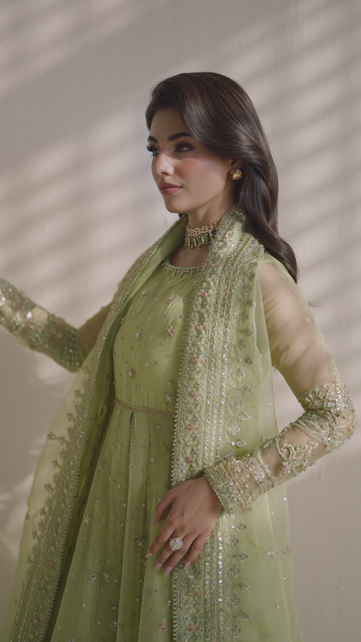 NAQSHI sage green ready-to-wear formal dress with soft embroidery and sheer dupatta, styled for elegant party occasions