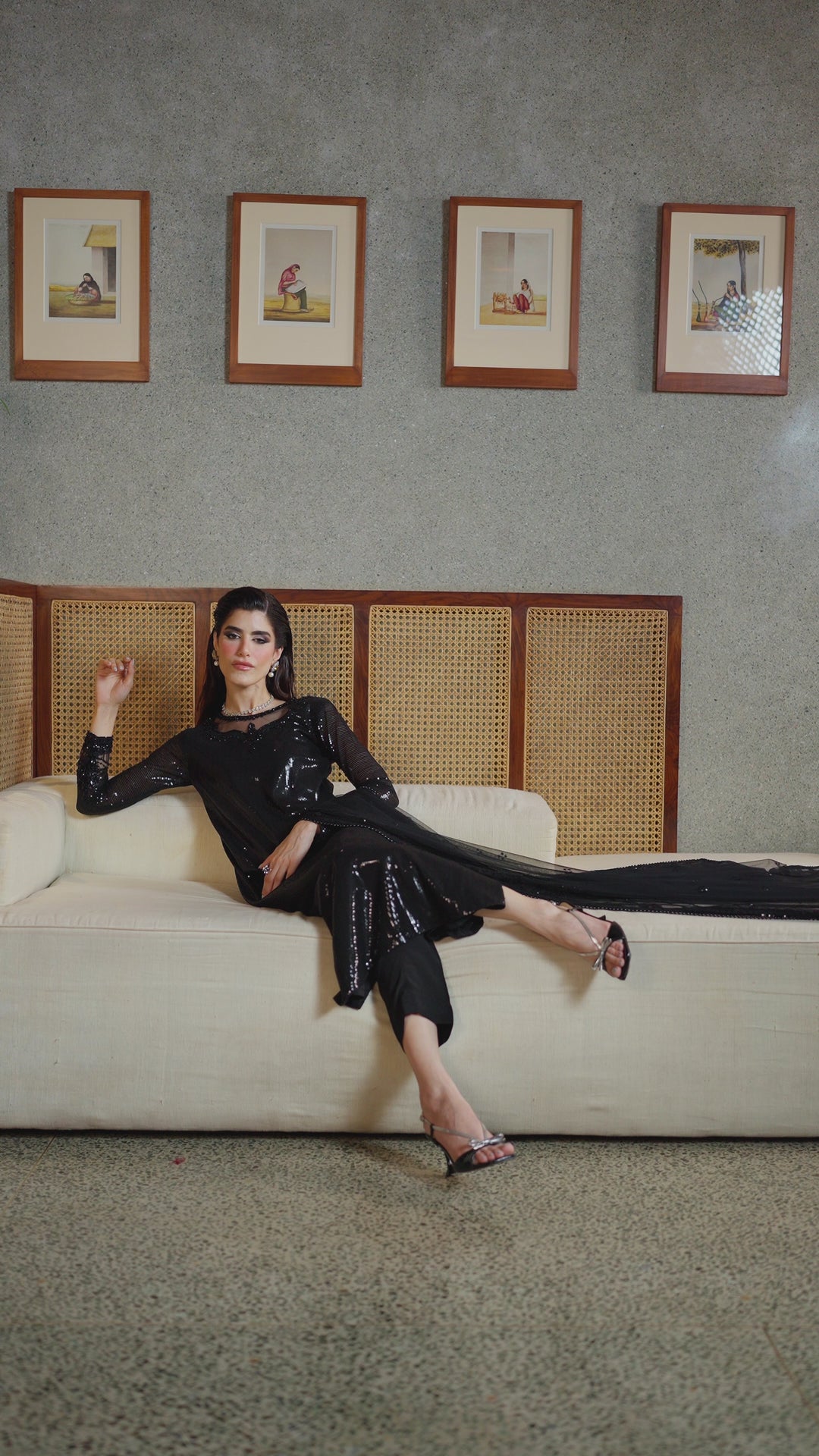 Walking view of NAQSHI Horleyn black net outfit showing soft movement, balanced shape, and elegant night event look.