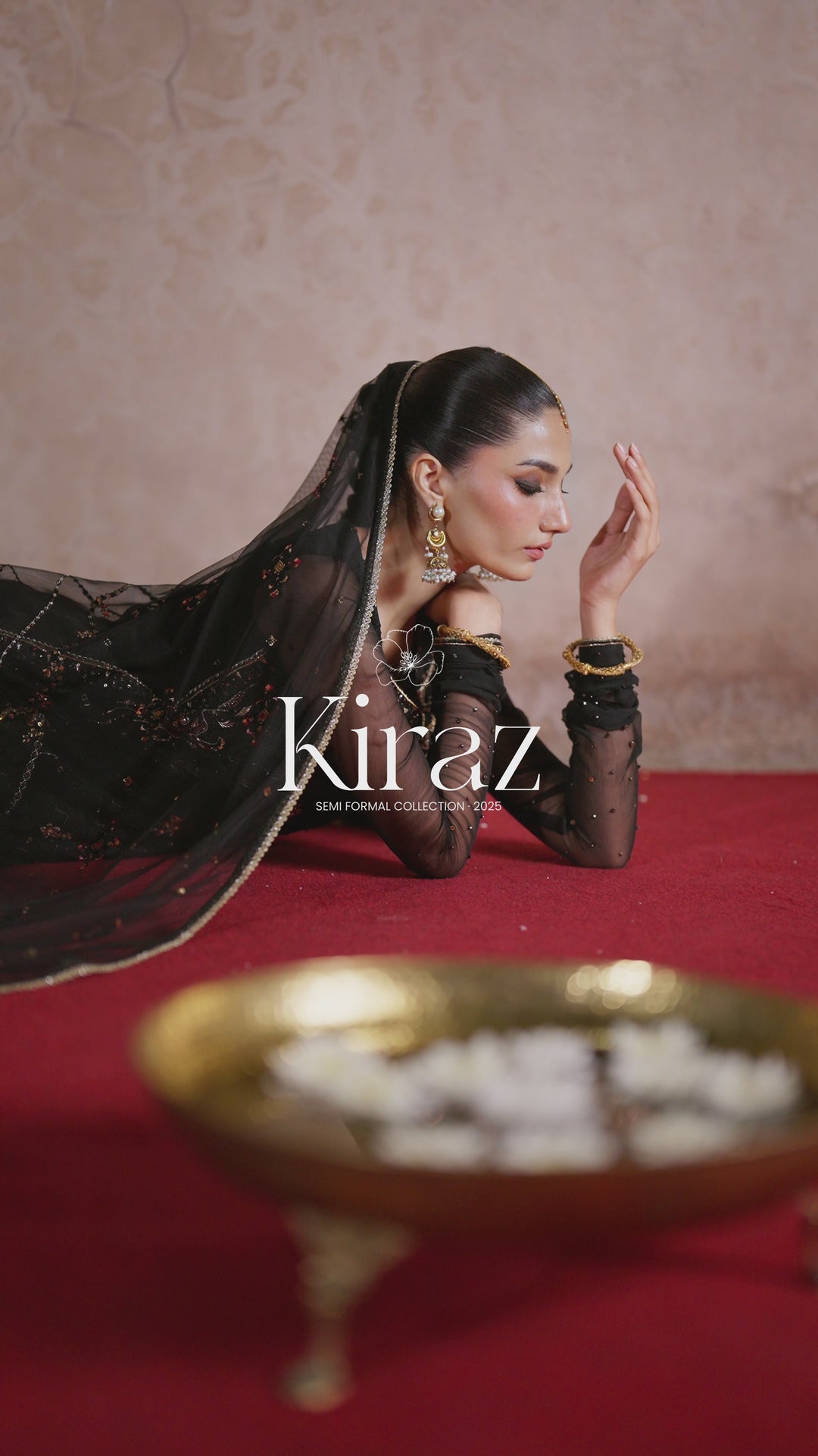 NAQSHI ready-to-wear black formal outfit shown in motion, displaying elegant fall, dupatta flow, and complete stitched event look