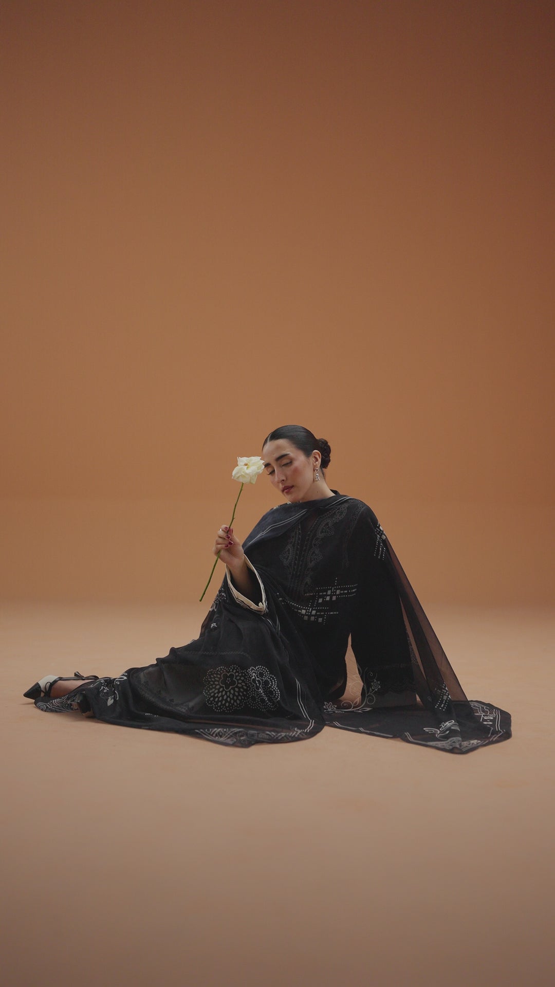Isla black ready-to-wear outfit video preview featuring embroidered lawn shirt, printed chiffon dupatta, and modern Eastern styling.
