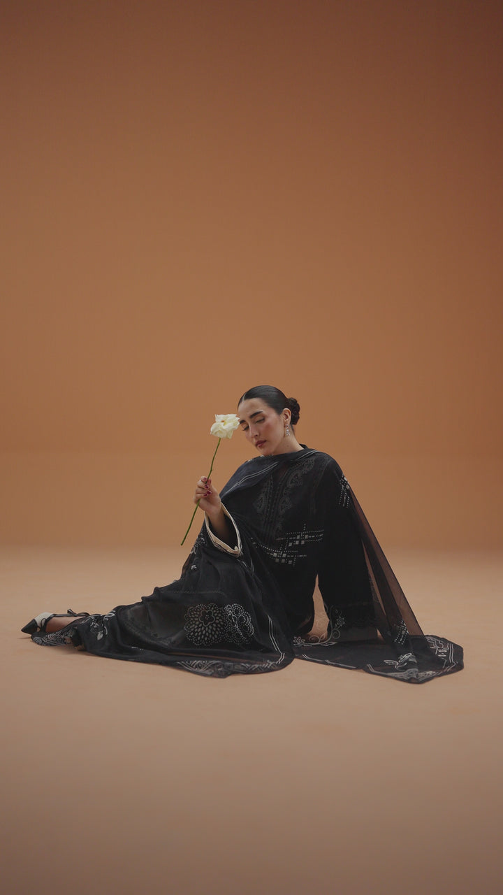 Isla black ready-to-wear outfit video preview featuring embroidered lawn shirt, printed chiffon dupatta, and modern Eastern styling.