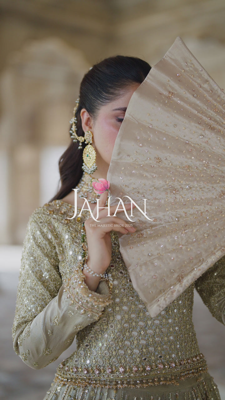 Video thumbnail of NAQSHI Ruhab champagne gold bridal gown highlighting heavy embroidery and movement of full skirt for wedding occasion.