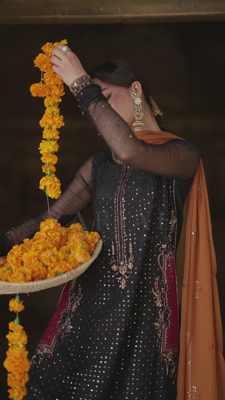 Zarim black and orange crinkle semi formal outfit video featuring embellished details, contrast dupatta and festive styling