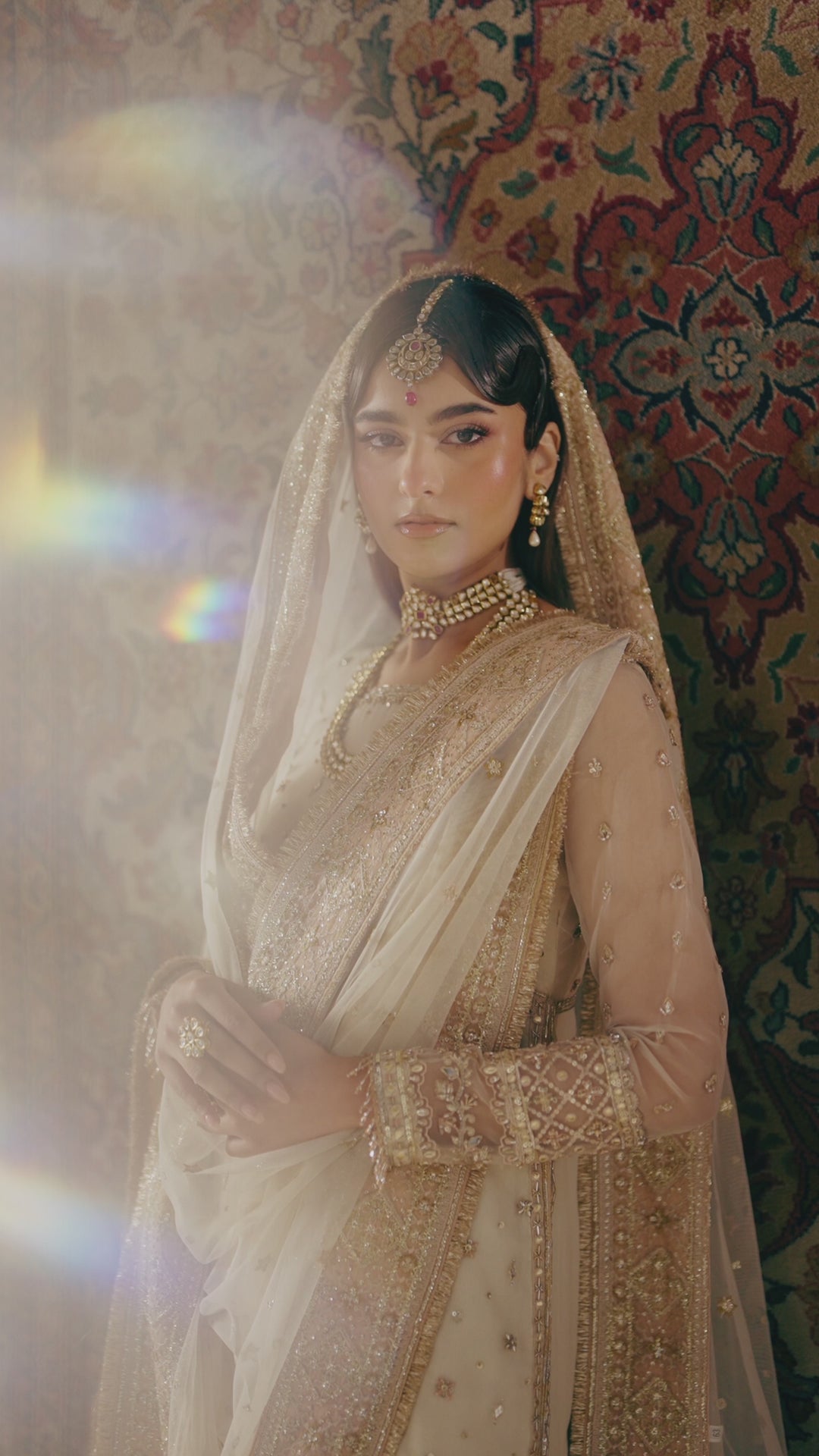 Soft bridal portrait of Zaleena honey beige 4-piece Nikkah outfit with dupatta over head, calm elegant modest ready made wedding attire.