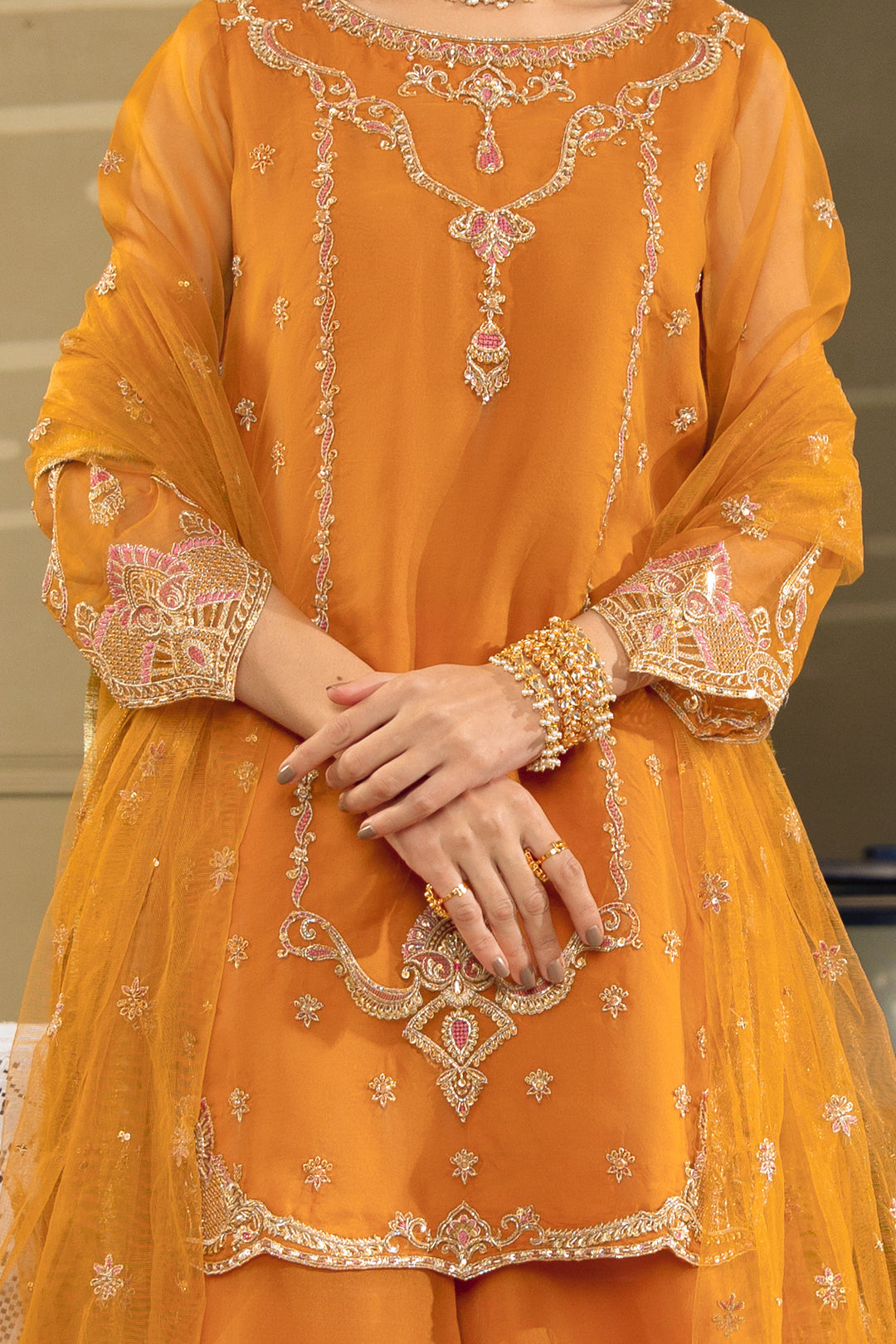 Close-up of NAQSHI Zaryaab short shirt showing embroidery, cutwork details, and fine organza finishing